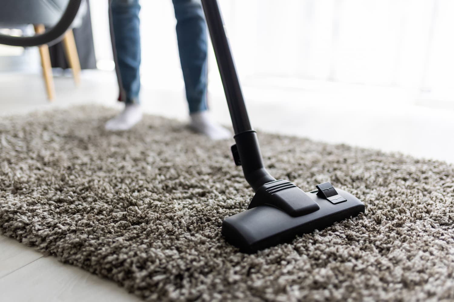 Vacuuming the carpet